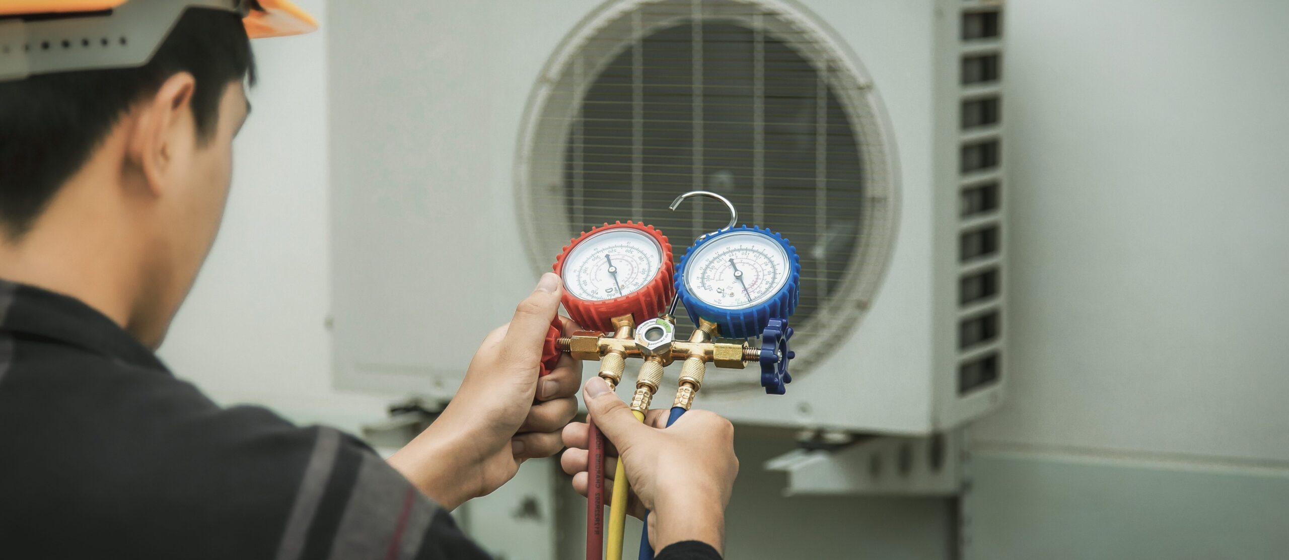 Jiaxin Aircon air conditioning service technician performing system check, detecting leaks, and adding refrigerant during maintenance
